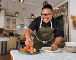 Chef Tien Tran plating a dish