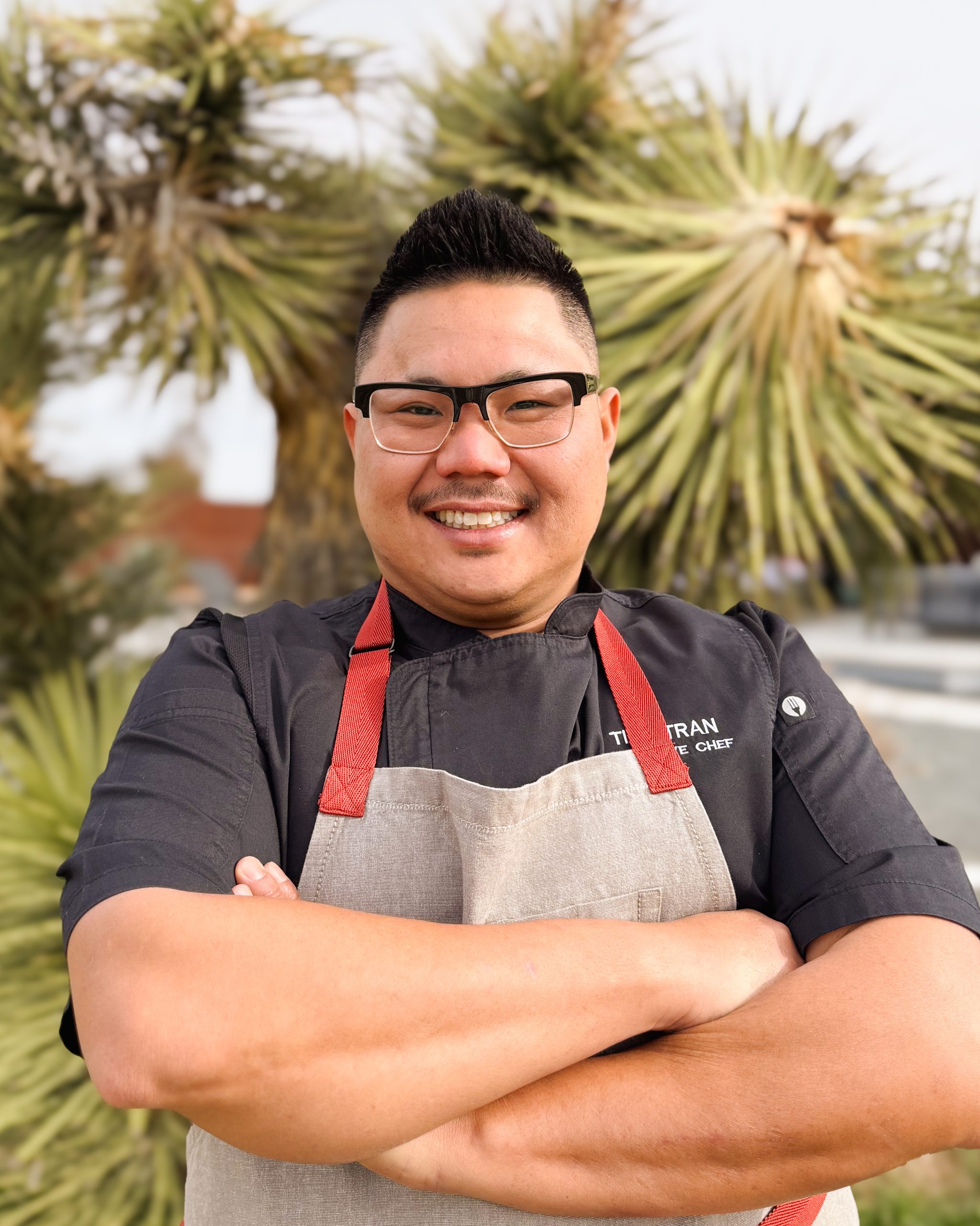 Chef Tien plating a Modern California dish at a private dinner in Palm Springs